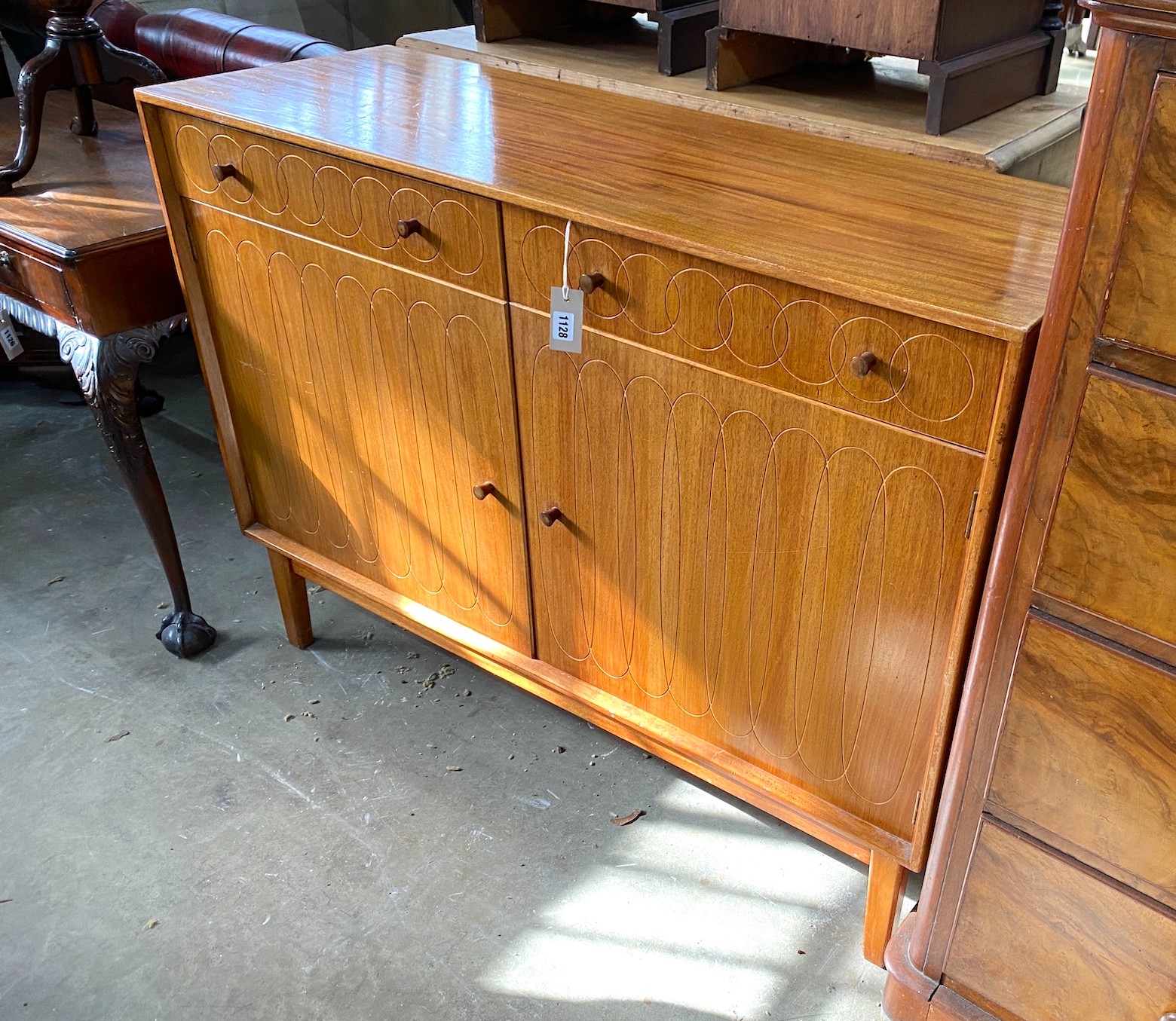 A mid century teak sideboard, length 122cm, depth 43cm, height 91cm